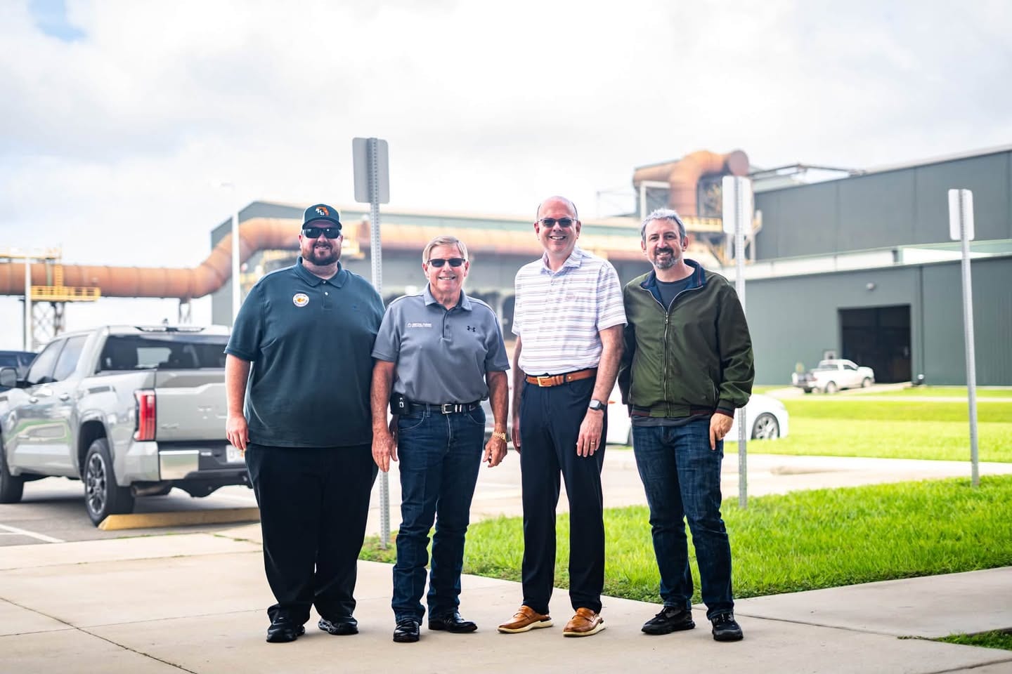 Austin Gravley, Rick Wilson, Adam Greenway and Corey Allain outside the Nucor Steel plant in Frostproof