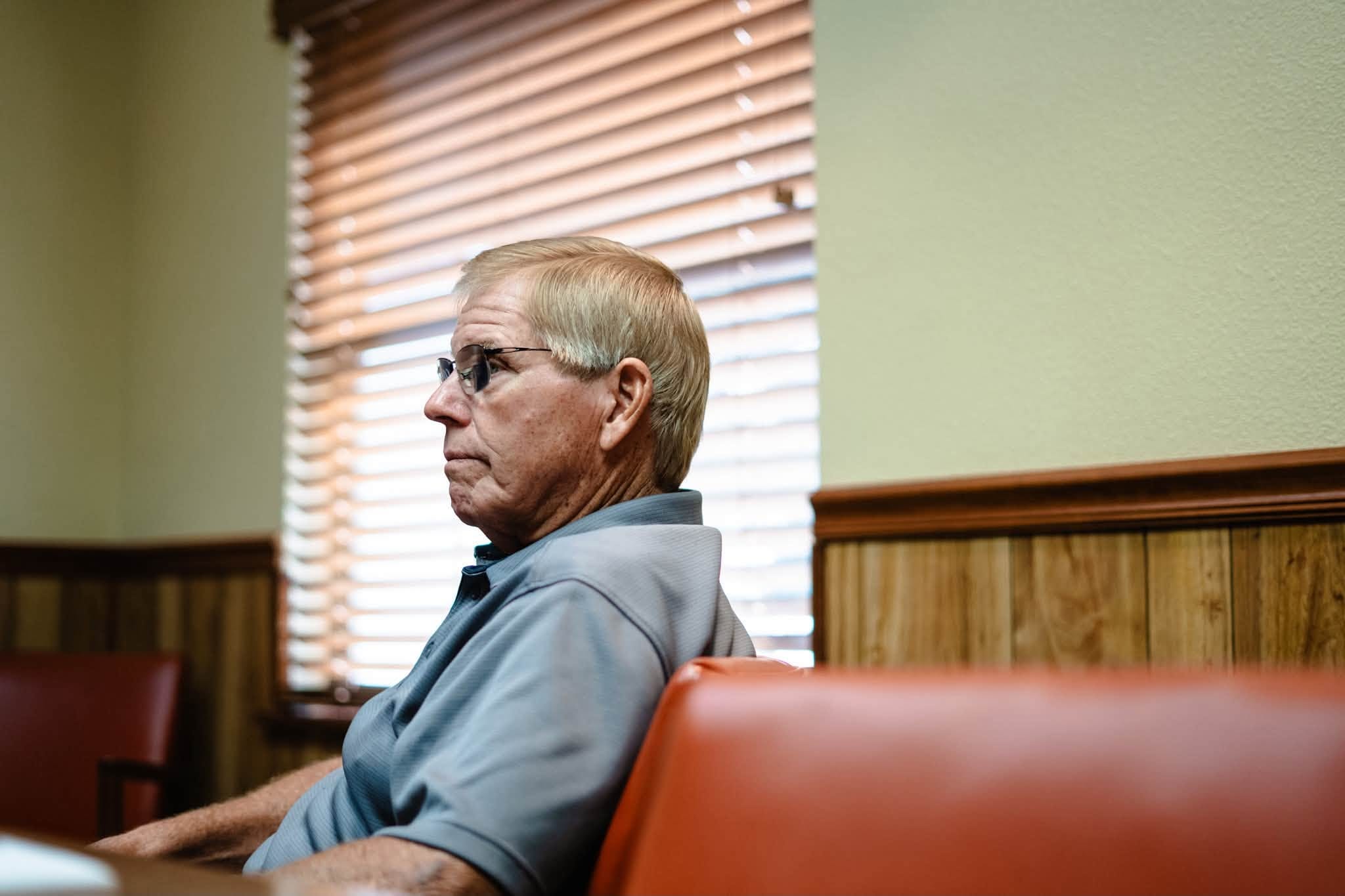 Rick Wilson listening during a meeting in Frostproof