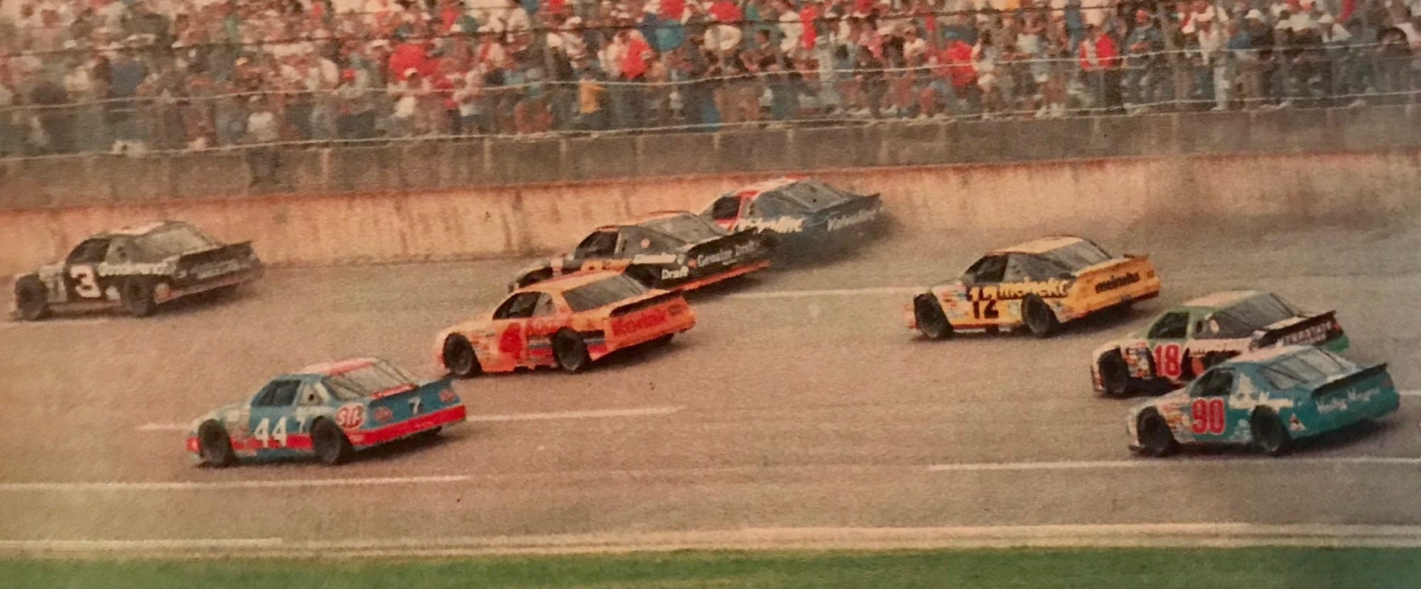 Rick Wilson leading a pack of cars in the Petty Enterprises No. 44 during a NASCAR Cup Series race